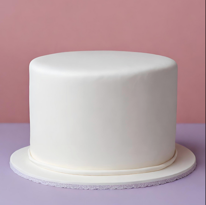 Professional cake artist covering a round cake tier with FondX Virgin White rolled fondant.