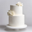 Clean, flawless white fondant cake tier covered in smooth FondX Virgin White rolled fondant icing.