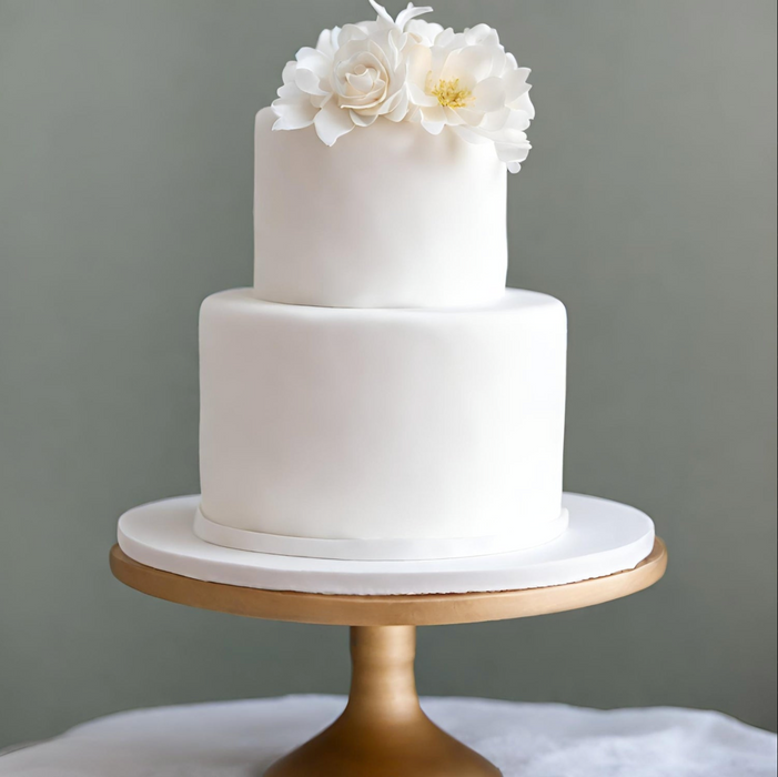 Elegant multi-tiered wedding cake styled with FondX Virgin White rolled fondant icing.